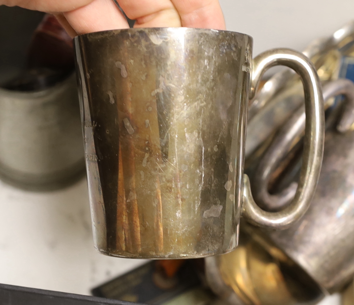 A group of assorted smoker's accoutrements and plated mugs